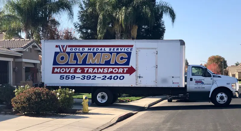 Olympic moving truck parked outside a home in a Fresno neighborhood